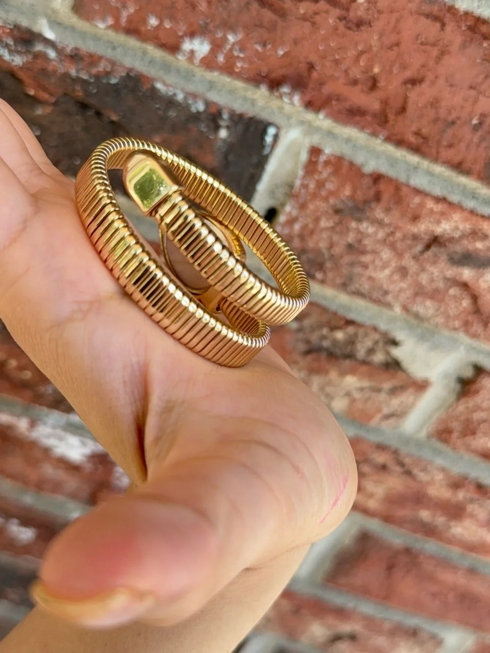 Gold serpentine bracelet watch